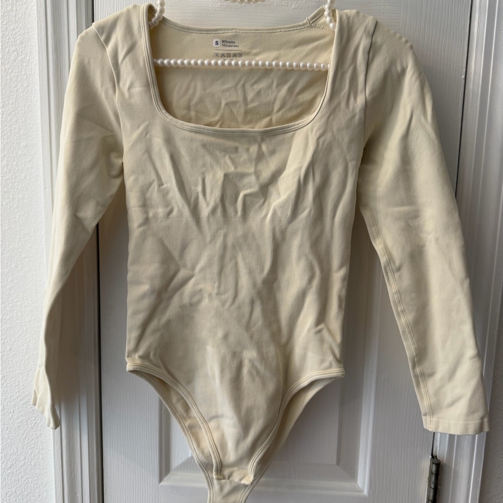 Long-Sleeve One-Piece Bodysuit in Cream